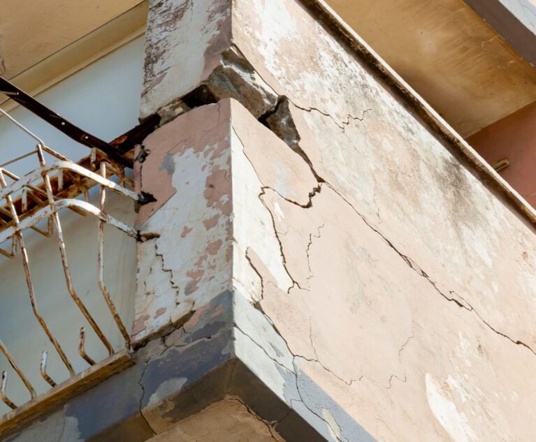 Balconies with cracked concrete and rusty irons requiring renovation.